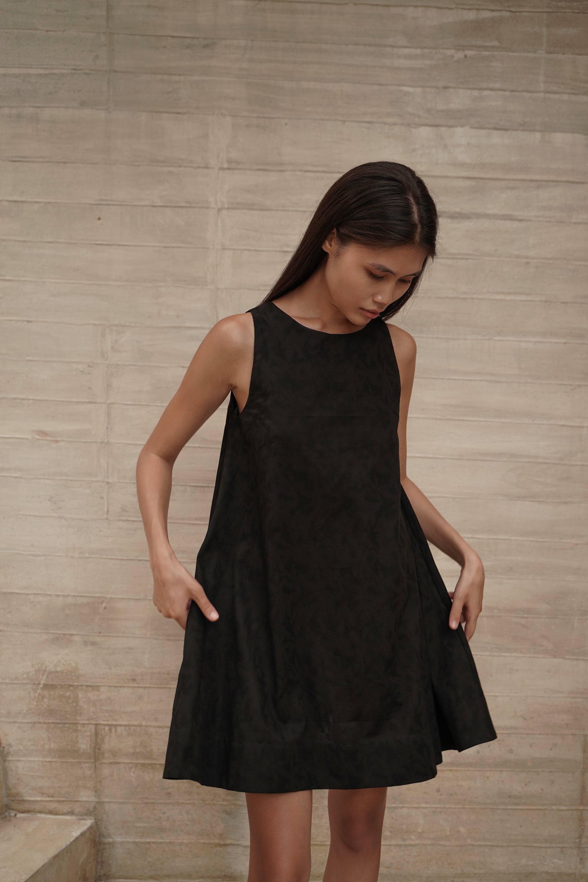 Trapeze Jacquard Dress – front, hands on dress