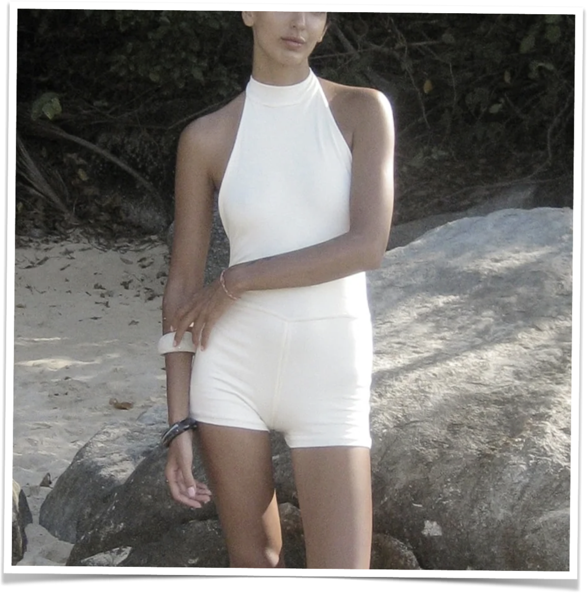 Short jumpsuit with an open back in ivory